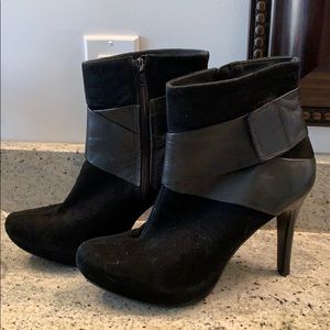 Woman’s black suede bootie